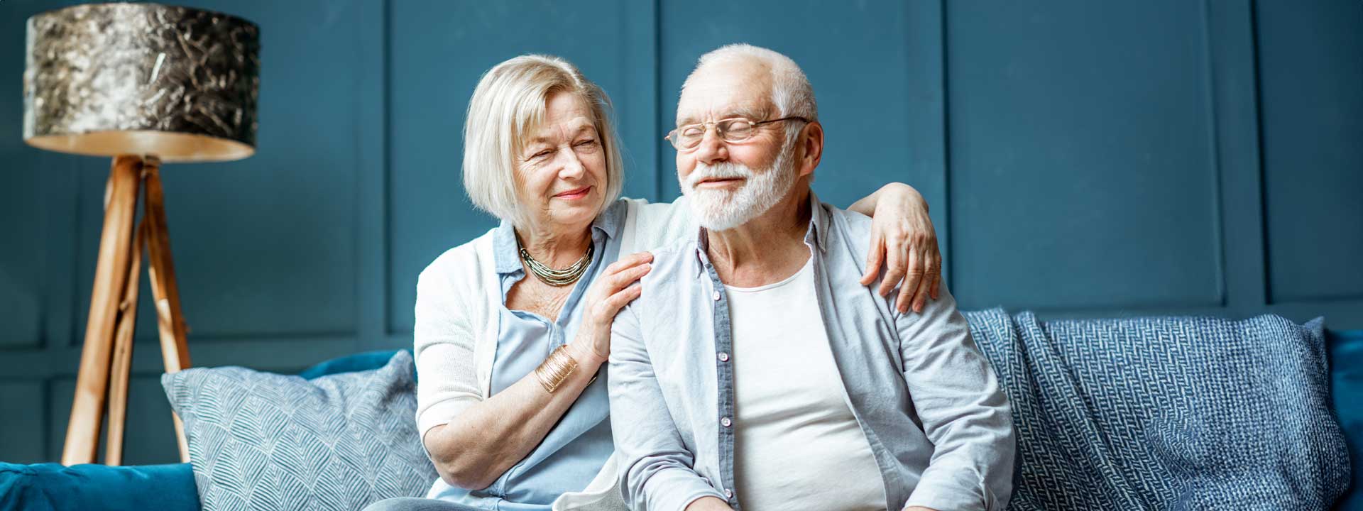 Elderly couple sitting side by side