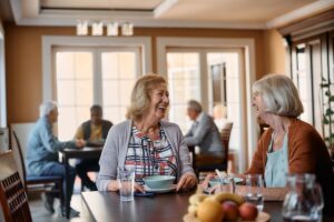 Older adults dining together in a senior living community