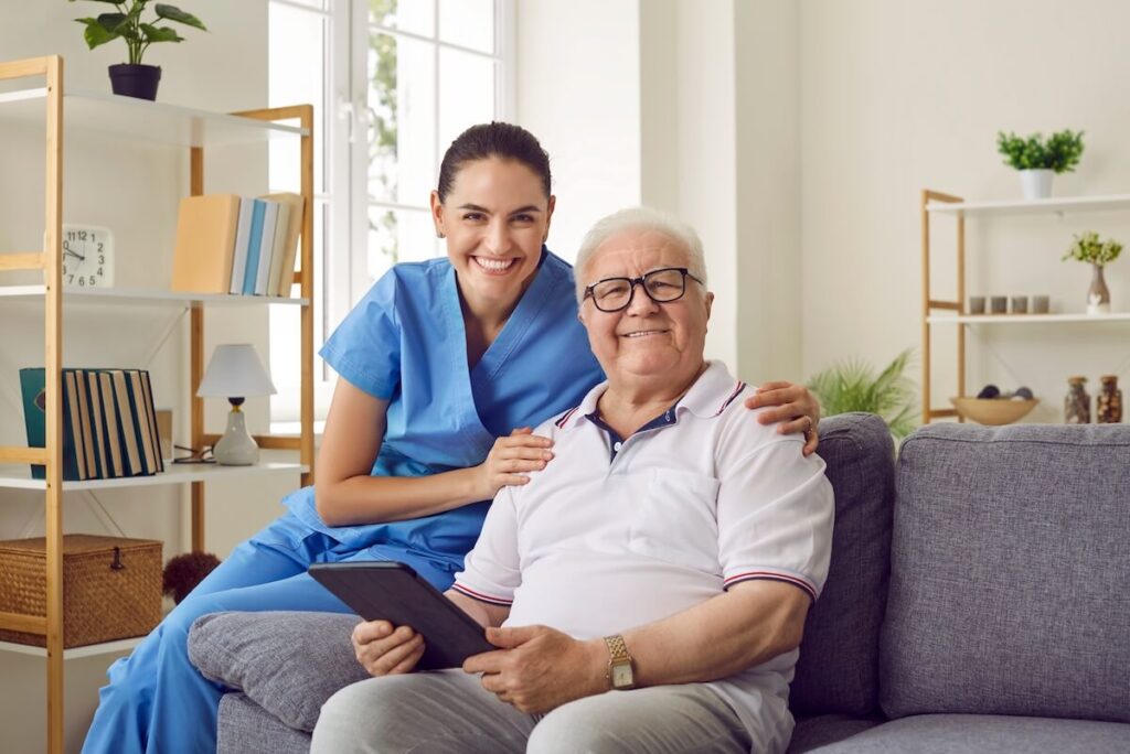 Caregiver hugging a senior